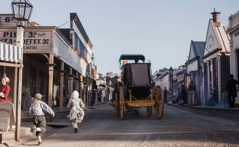 Children chasing a carraige in Sovereign Hill