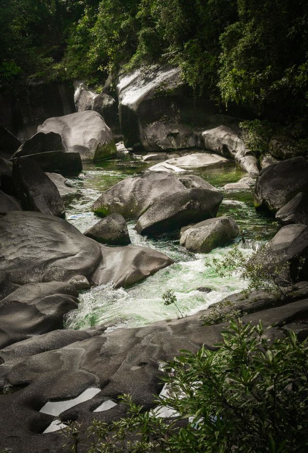Rapids and streams flowing through rocks at Babinda boulders in far north Queensland, Australia.