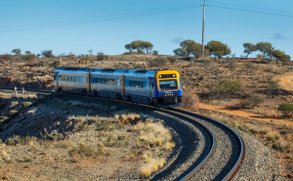 The Silver City Stiletto train bound for the Broken Heel Festival winds its way through Outback NSW.